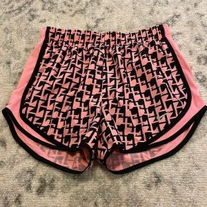 Pink and black nike shorts, size M